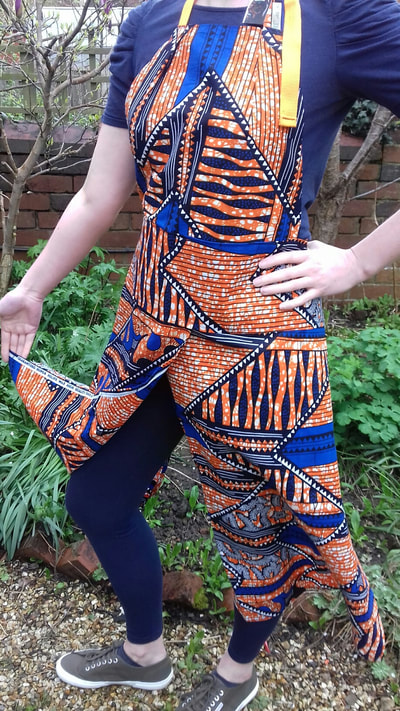 Pottery apron.Orange and blue African wax design apron- dynamic pattern.